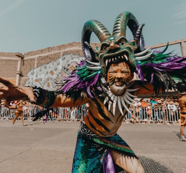 Man Celebrating Dominican Republic Carnival Wearing Mask and Costume of the Diablo Cojuelo.