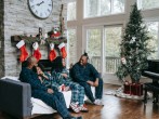 Happy black family enjoying Christmas holidays at home